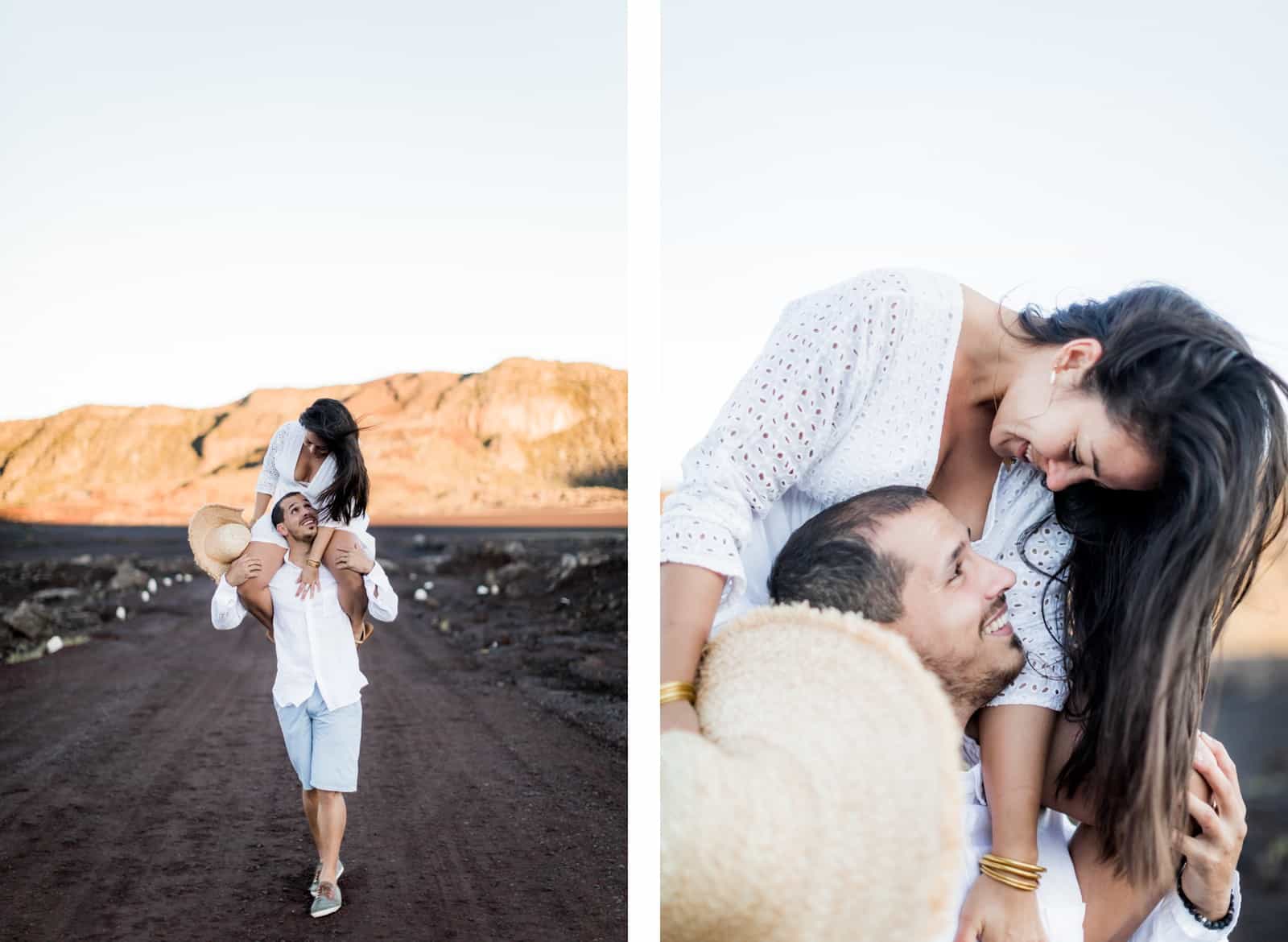 Photographie de Mathieu Dété, photographe de mariage et couple à Saint-Pierre de la Réunion 974, présentant une femme sur les épaules de son compagnon au lever du soleil à la Plaine des Sables, près du Piton de la Fournaise